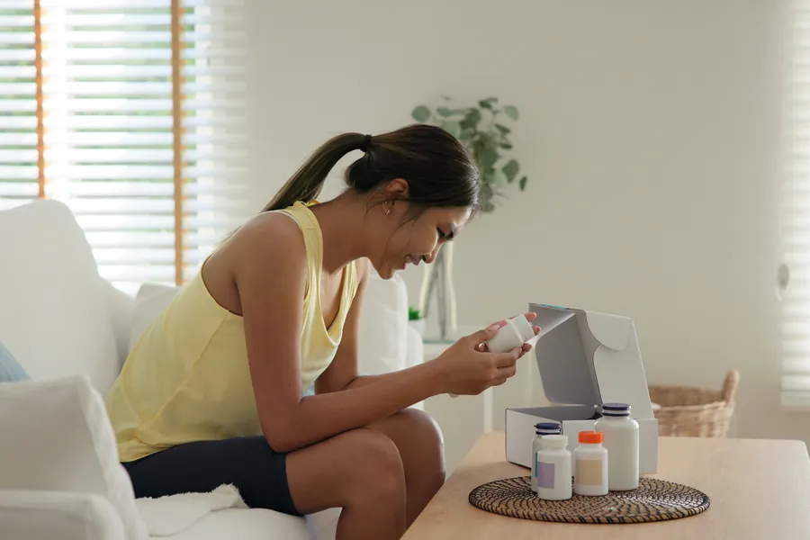 Woman checking supplements